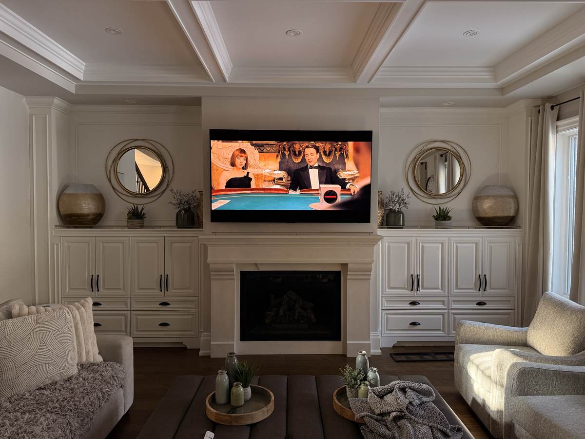 Centred above the mantel between custom built-ins