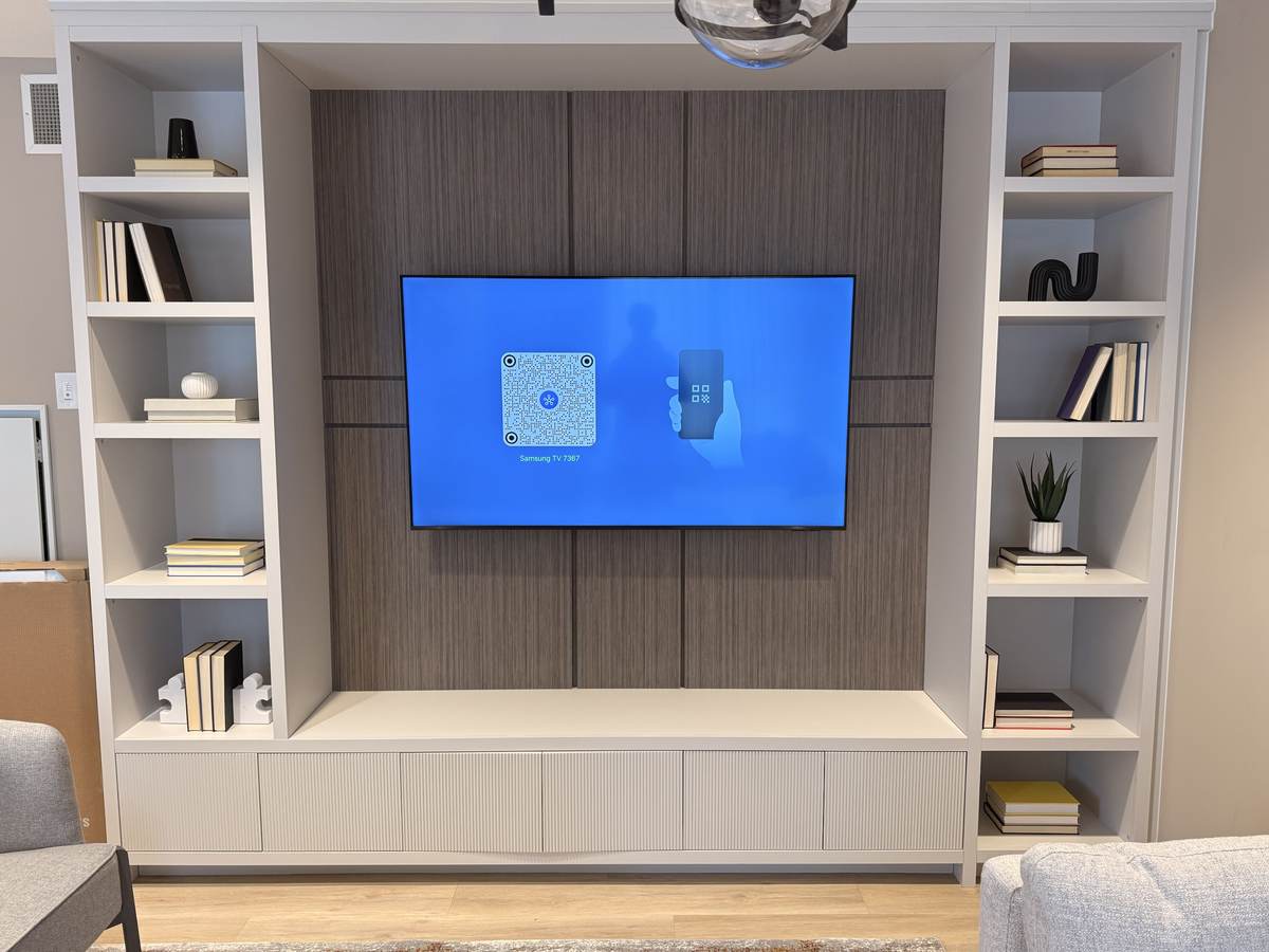 On a slatted wood panel in a built-in wall unit