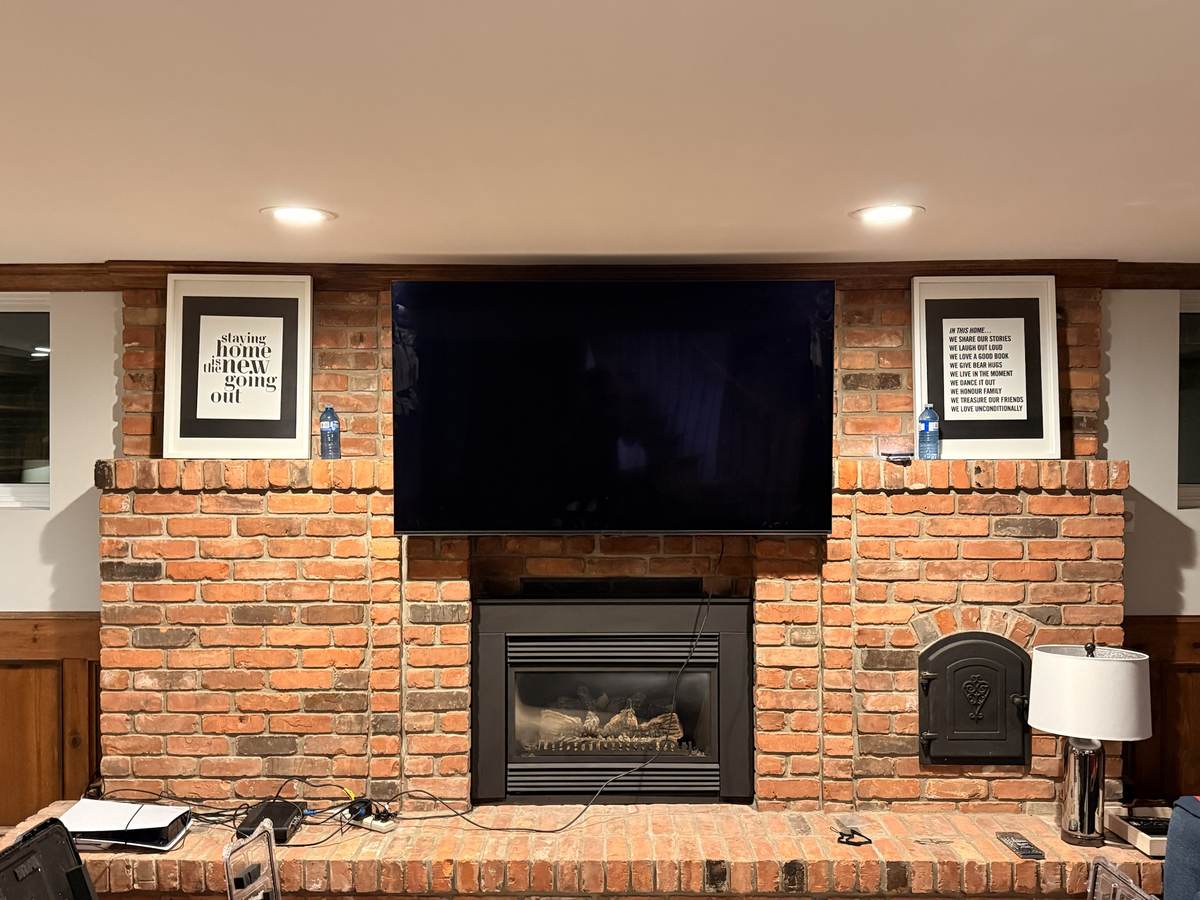 On a brick fireplace wall